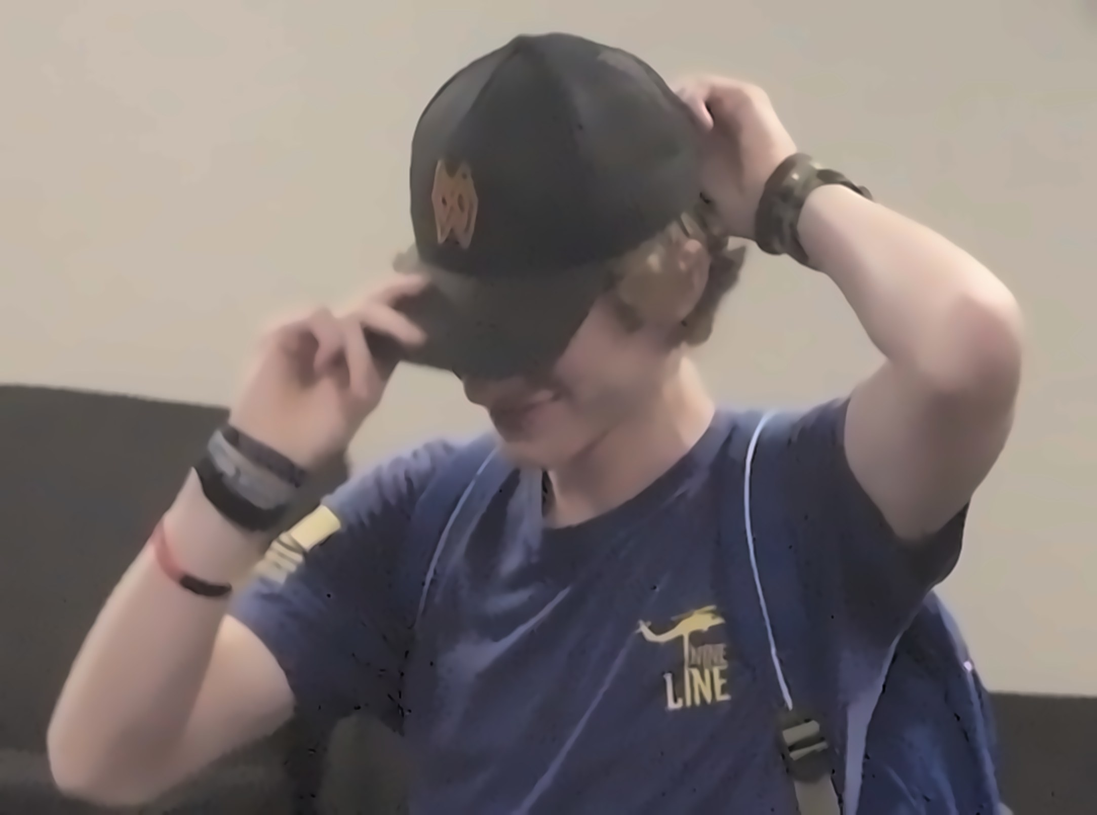 Seven Mountain Enterprises team member putting on a cap